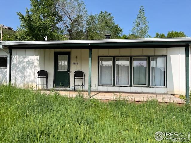 4809 Foothills Dr, Fort Collins, CO 80526 - back of house featuring a yard