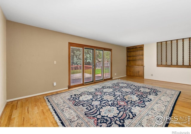 1409 Welch St, Fort Collins, CO 80524 - empty room with wood finished floors and baseboards