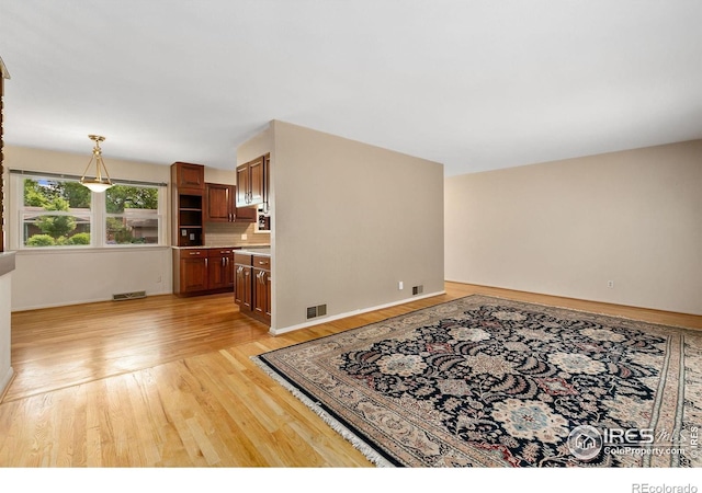 1409 Welch St, Fort Collins, CO 80524 - living area with light wood-style flooring and baseboards
