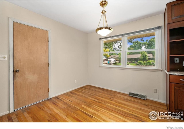 1409 Welch St, Fort Collins, CO 80524 - empty room with light wood-type flooring and baseboards
