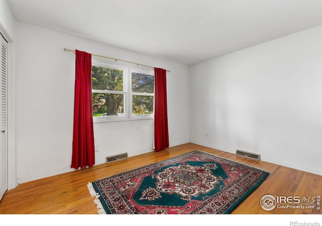 1409 Welch St, Fort Collins, CO 80524 - spare room featuring wood finished floors