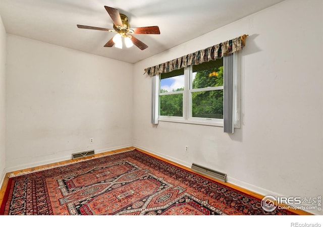 1409 Welch St, Fort Collins, CO 80524 - empty room featuring a ceiling fan, baseboards, and wood finished floors