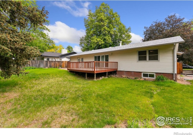 1409 Welch St, Fort Collins, CO 80524 - back of property featuring a wooden deck