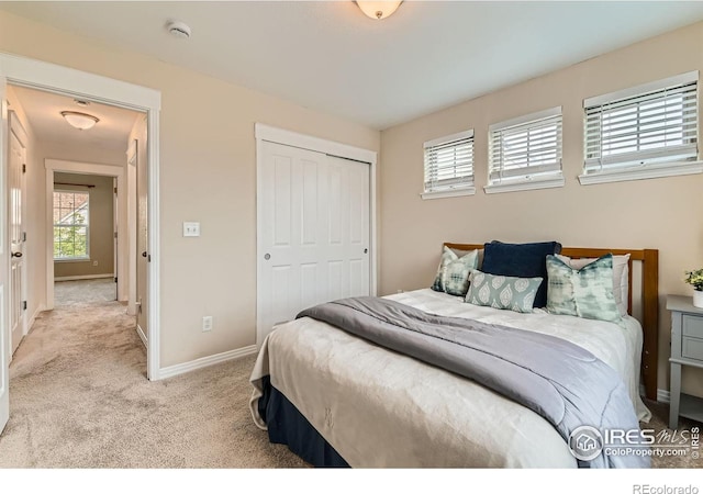 634 Homestead St, Lafayette, CO 80026 - bedroom with multiple windows, carpet flooring, baseboards, and a closet