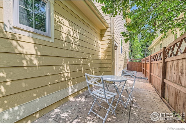 634 Homestead St, Lafayette, CO 80026 - fenced backyard featuring outdoor dining area and a patio