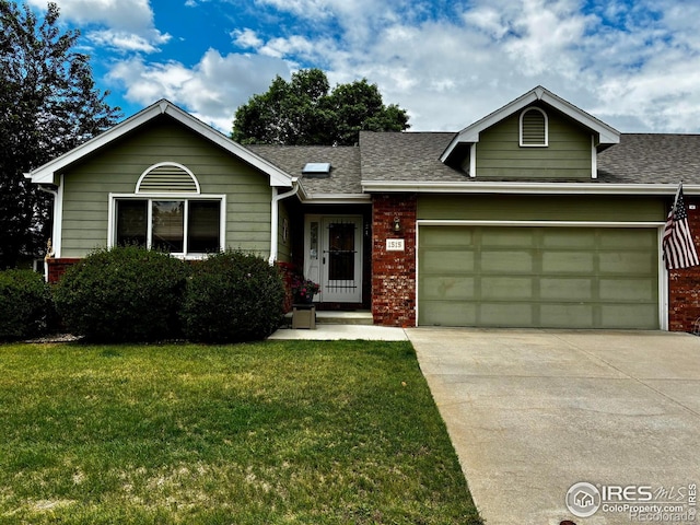 1515 Tulip Ct, Longmont, CO 80501 - view of front of home with a front lawn, a garage, concrete driveway, roof with shingles, and brick siding