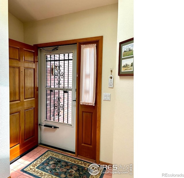 1515 Tulip Ct, Longmont, CO 80501 - foyer entrance featuring light tile patterned floors