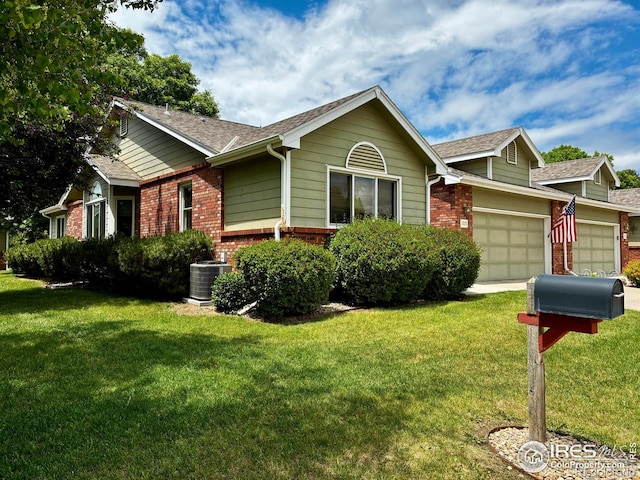 1515 Tulip Ct, Longmont, CO 80501 - ranch-style home with brick siding, a garage, a front lawn, and a shingled roof