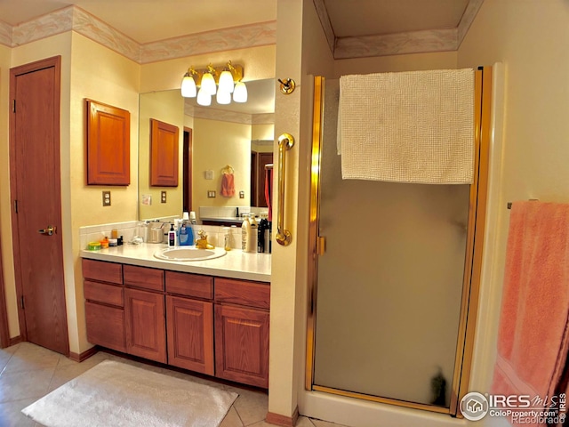 1515 Tulip Ct, Longmont, CO 80501 - bathroom featuring vanity, a stall shower, tile patterned floors, and ornamental molding