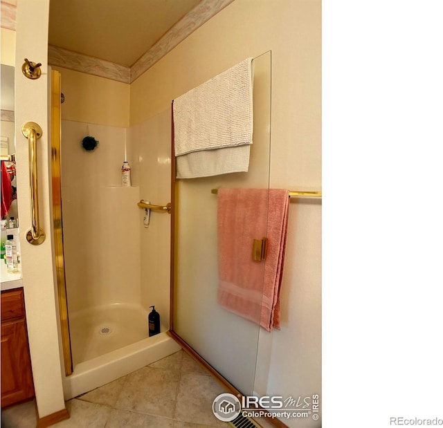1515 Tulip Ct, Longmont, CO 80501 - bathroom with a shower stall, vanity, and tile patterned flooring