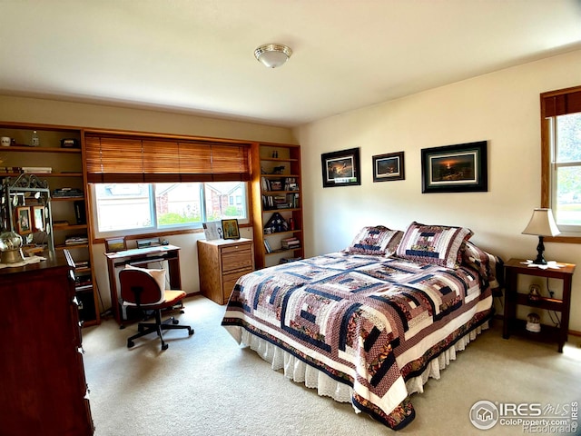 1515 Tulip Ct, Longmont, CO 80501 - bedroom featuring light colored carpet and an office area