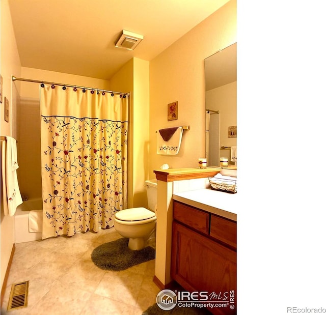 1515 Tulip Ct, Longmont, CO 80501 - full bathroom with vanity, toilet, shower / bath combination with curtain, and tile patterned flooring