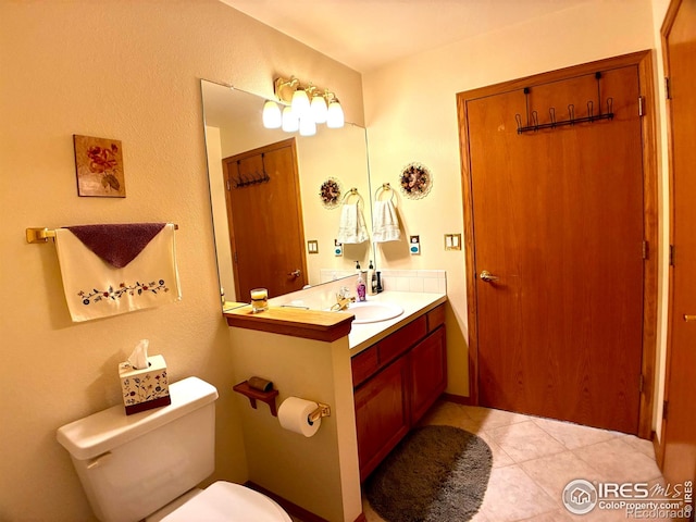 1515 Tulip Ct, Longmont, CO 80501 - bathroom with toilet, vanity, and tile patterned floors