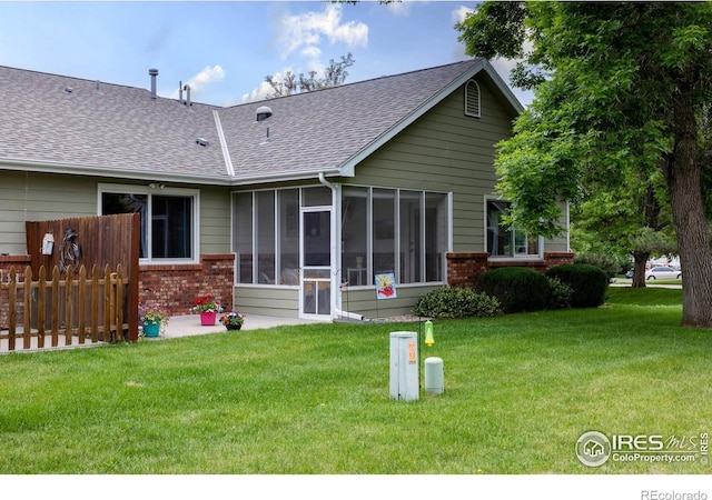 1515 Tulip Ct, Longmont, CO 80501 - back of property with brick siding, a shingled roof, and a sunroom