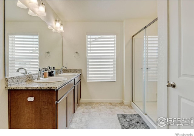 3657 Speedwell St, Wellington, CO 80549 - bathroom with double vanity, plenty of natural light, and an enclosed shower
