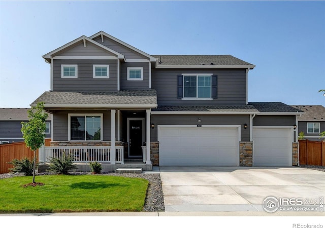 3657 Speedwell St, Wellington, CO 80549 - craftsman-style house with a porch, driveway, a garage, stone siding, and roof with shingles