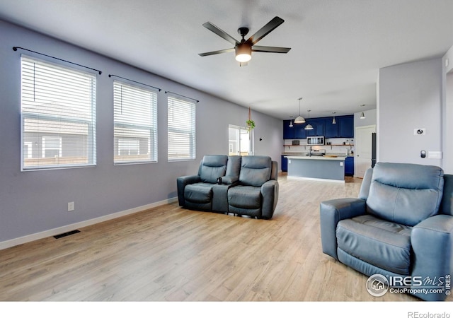 3657 Speedwell St, Wellington, CO 80549 - living room with a ceiling fan and light wood-type flooring