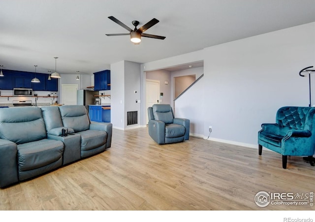 3657 Speedwell St, Wellington, CO 80549 - living area featuring light wood-style floors and a ceiling fan
