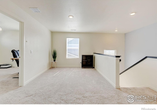 3657 Speedwell St, Wellington, CO 80549 - carpeted empty room featuring plenty of natural light and recessed lighting