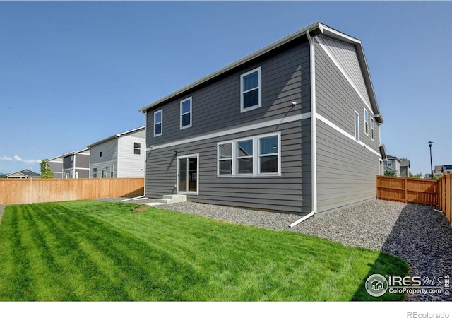 3657 Speedwell St, Wellington, CO 80549 - rear view of house with a fenced backyard