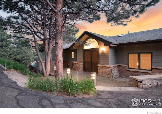 142 Meadowlook Way, Boulder, CO 80304 - view of front of home with stone siding and a shingled roof