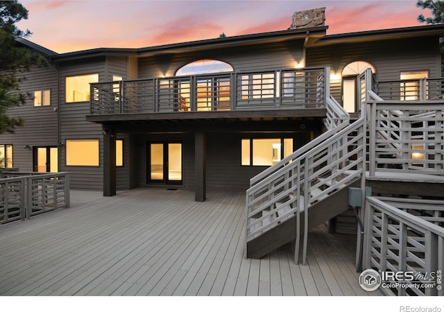 142 Meadowlook Way, Boulder, CO 80304 - back of property at dusk featuring a balcony and a deck