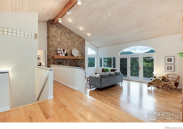 142 Meadowlook Way, Boulder, CO 80304 - living room featuring wood finished floors, french doors, high vaulted ceiling, wood ceiling with exposed beams, and a fireplace
