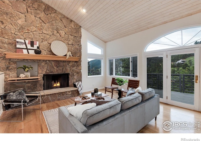 142 Meadowlook Way, Boulder, CO 80304 - living room with wood ceiling, wood finished floors, high vaulted ceiling, a stone fireplace, and baseboards
