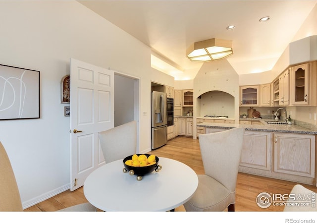 142 Meadowlook Way, Boulder, CO 80304 - kitchen with a sink, stainless steel refrigerator with ice dispenser, glass insert cabinets, light wood finished floors, and a peninsula