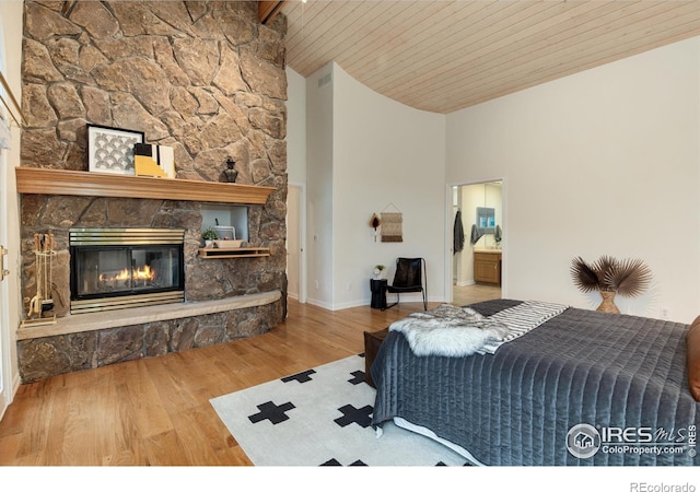 142 Meadowlook Way, Boulder, CO 80304 - bedroom featuring high vaulted ceiling, wood finished floors, wood ceiling with exposed beams, a fireplace, and baseboards