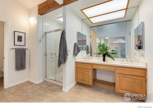 142 Meadowlook Way, Boulder, CO 80304 - bathroom featuring double vanity, a shower stall, and baseboards