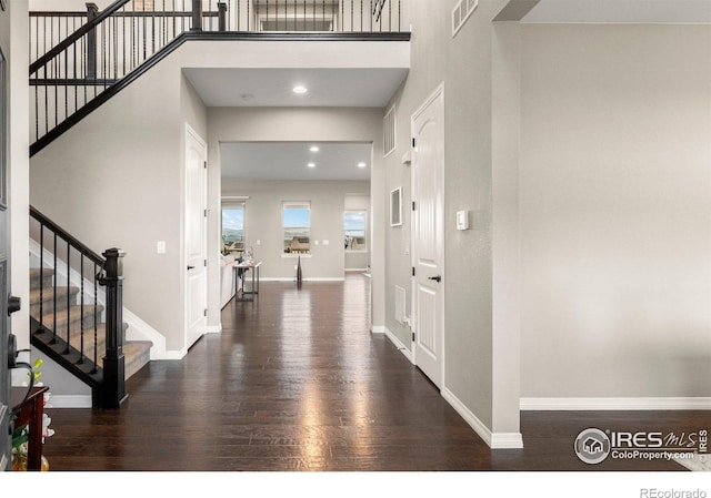 3075 Blue Mountain Dr, Broomfield, CO 80023 - entrance foyer featuring wood finished floors, stairs, baseboards, recessed lighting, and a towering ceiling