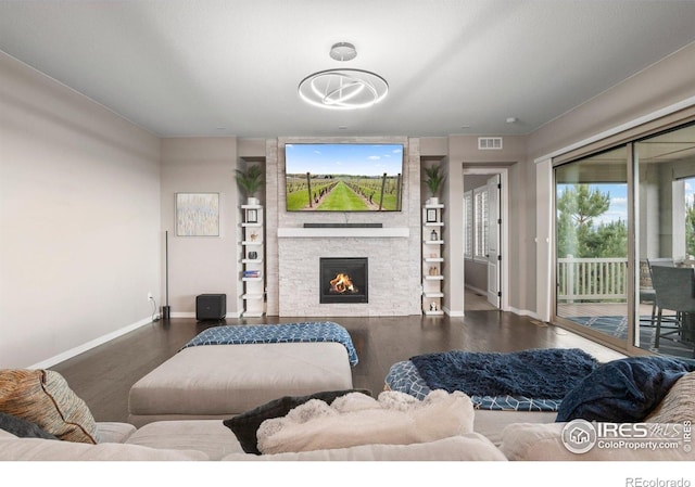 3075 Blue Mountain Dr, Broomfield, CO 80023 - living area featuring baseboards, wood finished floors, and a fireplace