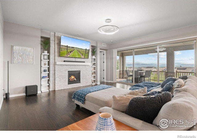 3075 Blue Mountain Dr, Broomfield, CO 80023 - living area with baseboards, wood finished floors, a fireplace, and built in features