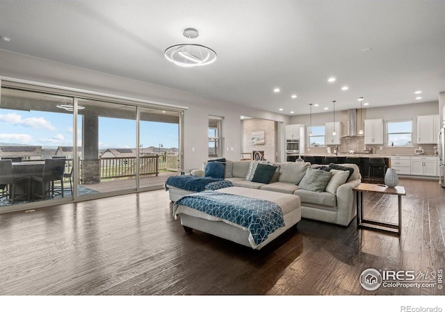 3075 Blue Mountain Dr, Broomfield, CO 80023 - living room featuring dark wood finished floors and recessed lighting