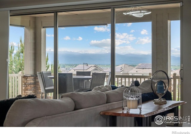 3075 Blue Mountain Dr, Broomfield, CO 80023 - living area featuring plenty of natural light and a mountain view