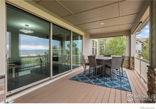 3075 Blue Mountain Dr, Broomfield, CO 80023 - wooden terrace featuring outdoor dining area