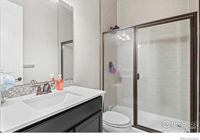 3075 Blue Mountain Dr, Broomfield, CO 80023 - bathroom featuring vanity, toilet, and a stall shower