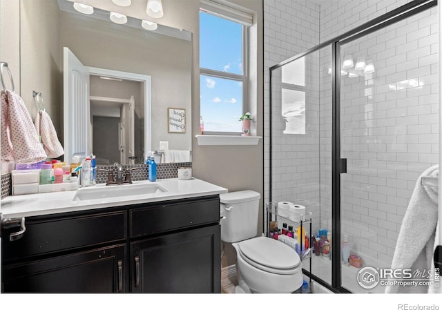 3075 Blue Mountain Dr, Broomfield, CO 80023 - full bathroom with vanity, a stall shower, and toilet