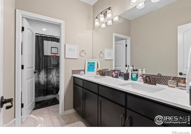 3075 Blue Mountain Dr, Broomfield, CO 80023 - bathroom with double vanity, tile patterned floors, and baseboards
