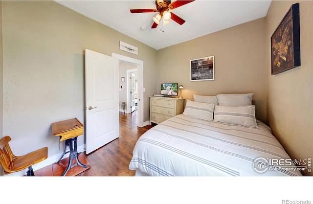 904 N Jefferson Ave, Loveland, CO 80537 - bedroom with wood finished floors, baseboards, and a ceiling fan
