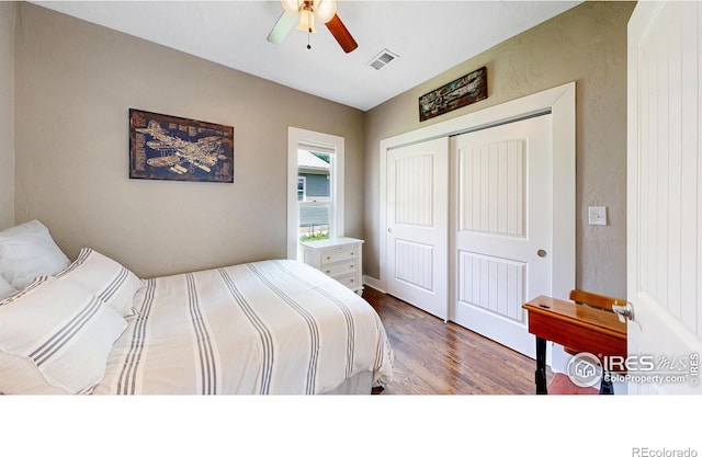 904 N Jefferson Ave, Loveland, CO 80537 - bedroom featuring wood finished floors, a closet, and a ceiling fan