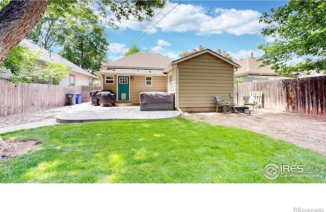 904 N Jefferson Ave, Loveland, CO 80537 - rear view of property featuring a patio and an outbuilding
