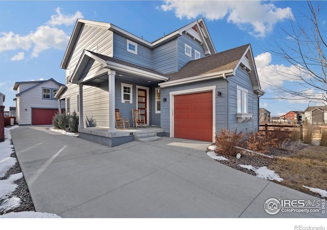 1958 Autumn Moon Dr, Windsor, CO 80550 - view of front of home featuring covered porch, concrete driveway, a garage, and roof with shingles