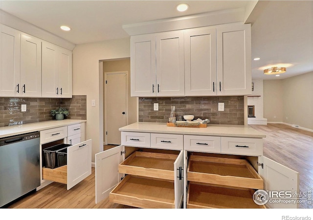 2217 14th St, Greeley, CO 80631 - kitchen with dishwasher, backsplash, white cabinetry, and recessed lighting