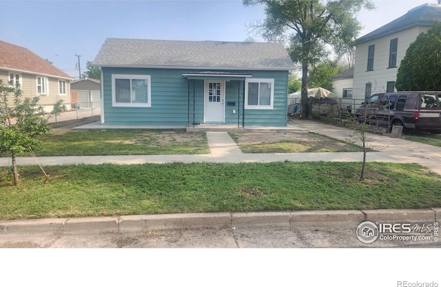 222 Platte St, Sterling, CO 80751 - bungalow featuring a shingled roof