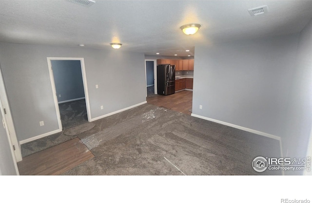 222 Platte St, Sterling, CO 80751 - unfurnished room with dark colored carpet, baseboards, and recessed lighting