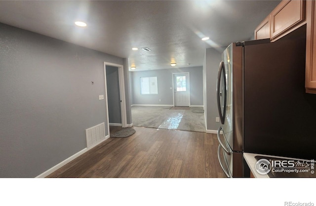 222 Platte St, Sterling, CO 80751 - kitchen featuring freestanding refrigerator, wood finished floors, baseboards, recessed lighting, and open floor plan