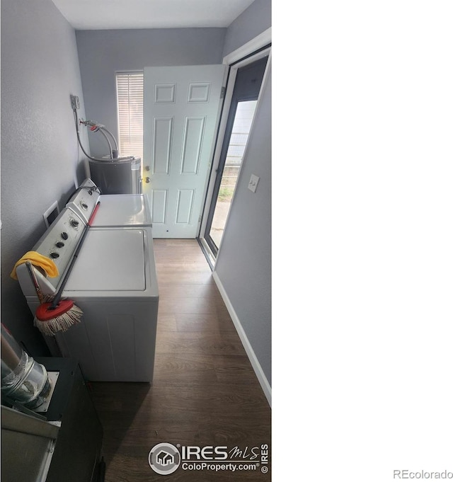 222 Platte St, Sterling, CO 80751 - washroom featuring washing machine and clothes dryer, wood finished floors, and baseboards
