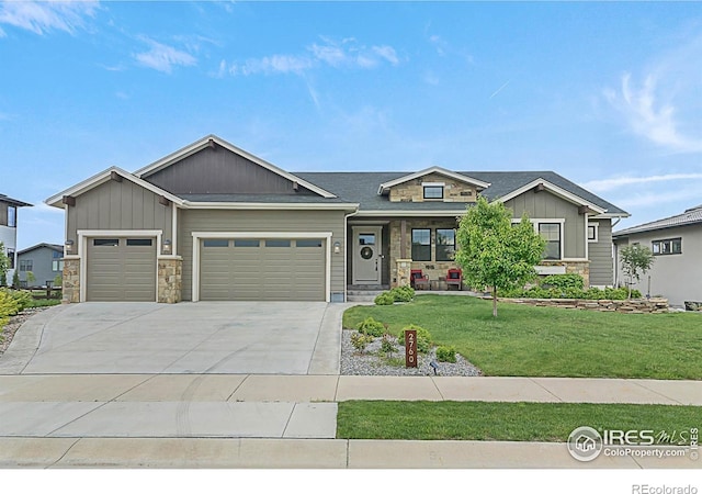 2760 Majestic View Dr, Timnath, CO 80547 - craftsman inspired home featuring stone siding, an attached garage, a front yard, a porch, and board and batten siding
